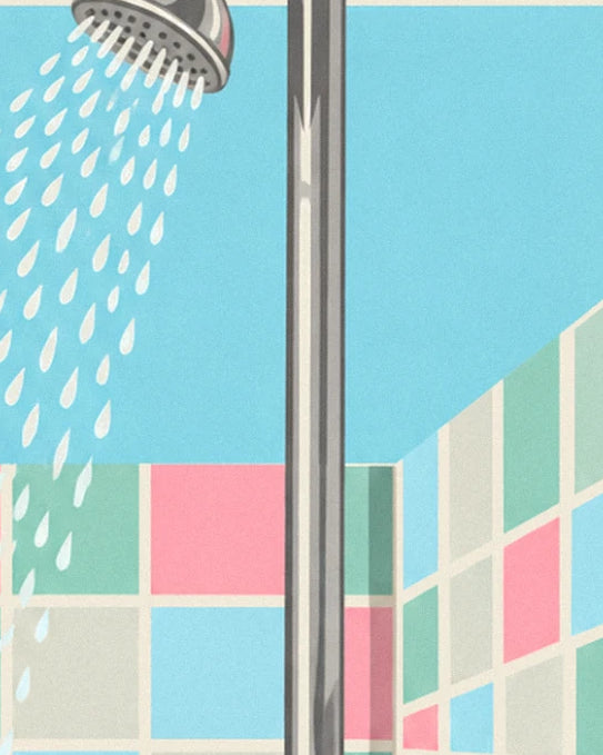 The chrome shower head and its water droplets against a sky-blue background