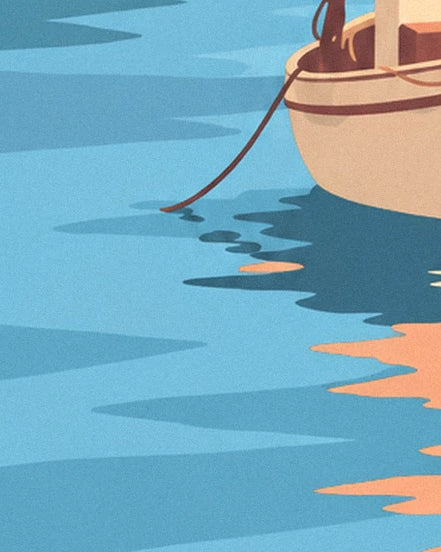 The sailing boat's cream hull, its brown ropes and its orange reflections on the blue water