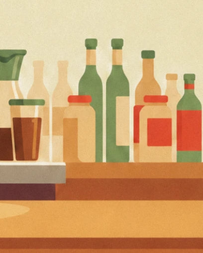 Green and red bottles, jars and a glass of brown coffee on the counter