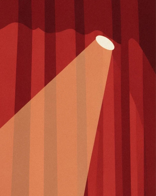 A spotlight beam lighting the folds of the red velvet curtain