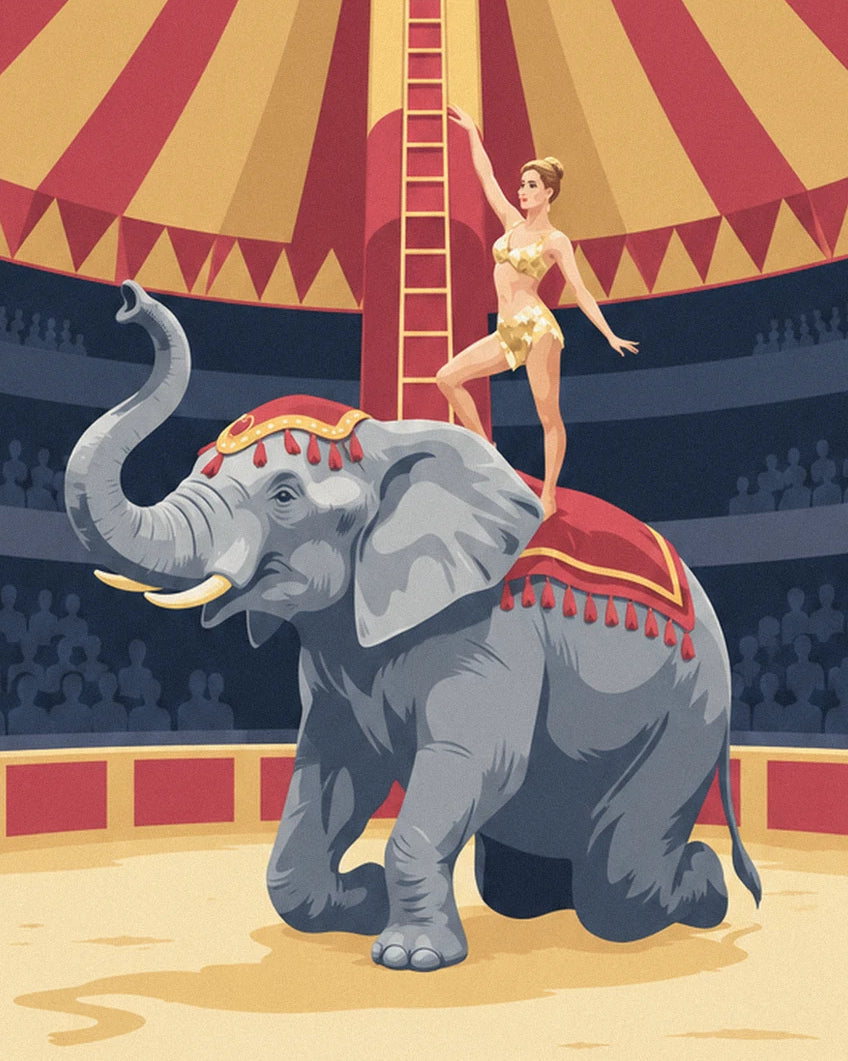 The kneeling grey elephant with its trunk raised and the acrobat in gold standing on its red blanket