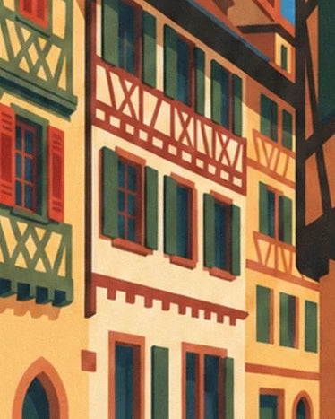 Les façades à colombages rouges et verts, rythmées de fenêtres aux volets ouverts
