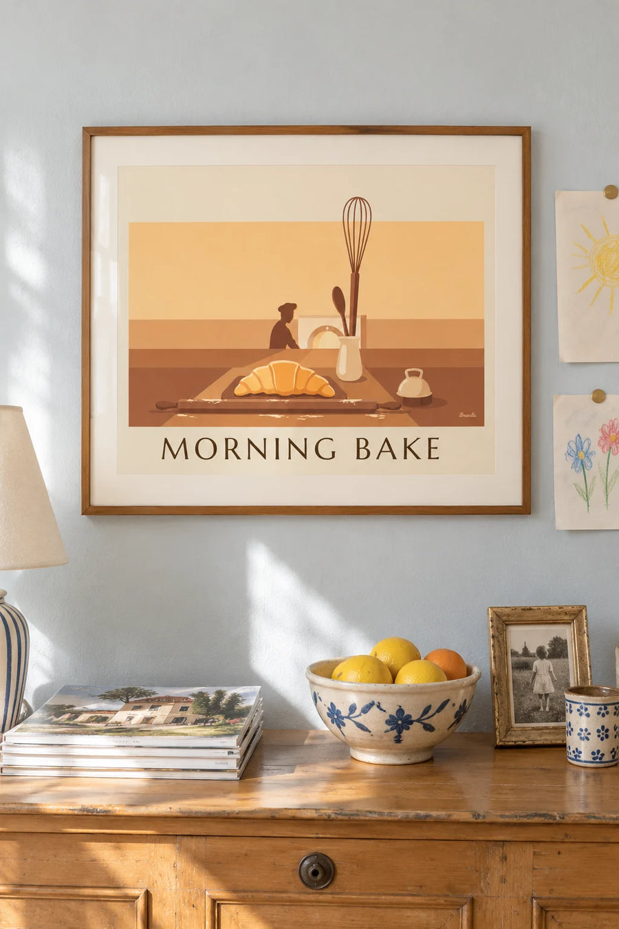 Poster of a croissant and pastry utensils in front of the oven: framed on the wall