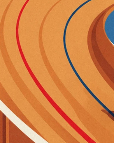 Le virage de la piste en bois orangé, parcouru de lignes rouge et bleue