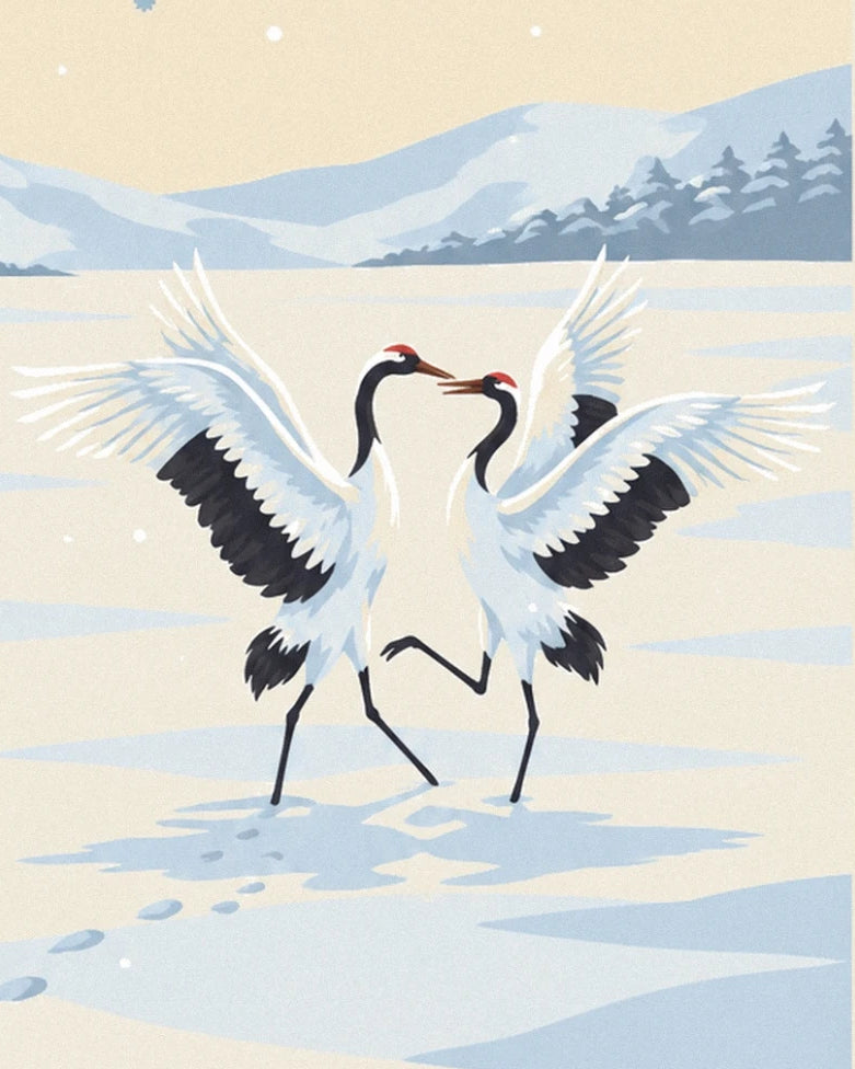 Les 2 grues blanches face à face, ailes déployées dans la neige
