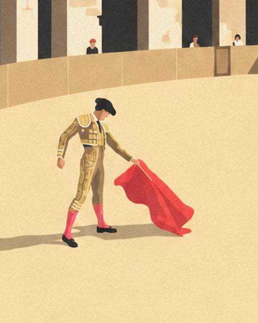 Le matador en habit d'or et sa cape rouge, seul sur le sable de l'arène