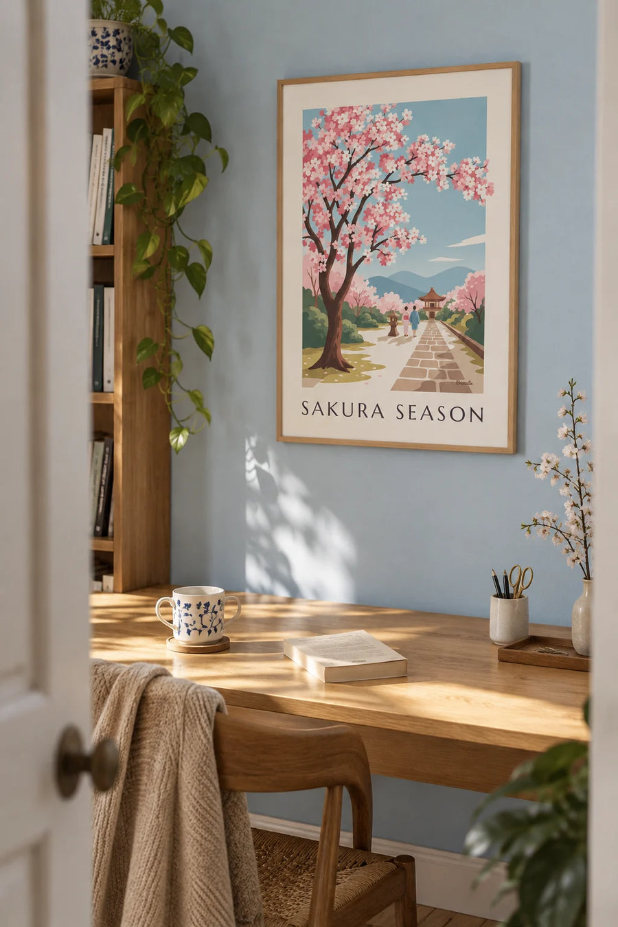 Blooming Japanese cherry blossom branch poster: framed on the wall