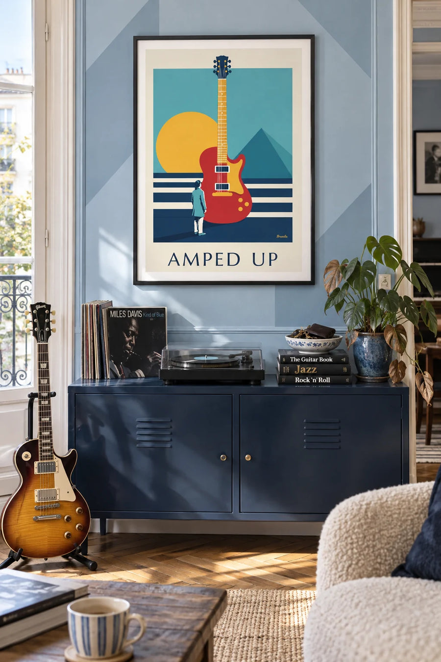 Poster of an electric guitar with geometric patterns: framed on the wall
