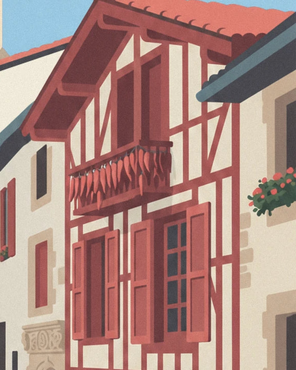 The red half-timbered façade with chillies hanging from the balcony