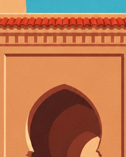 The pointed arch in ochre and brown shades beneath a frieze and red roof tiles