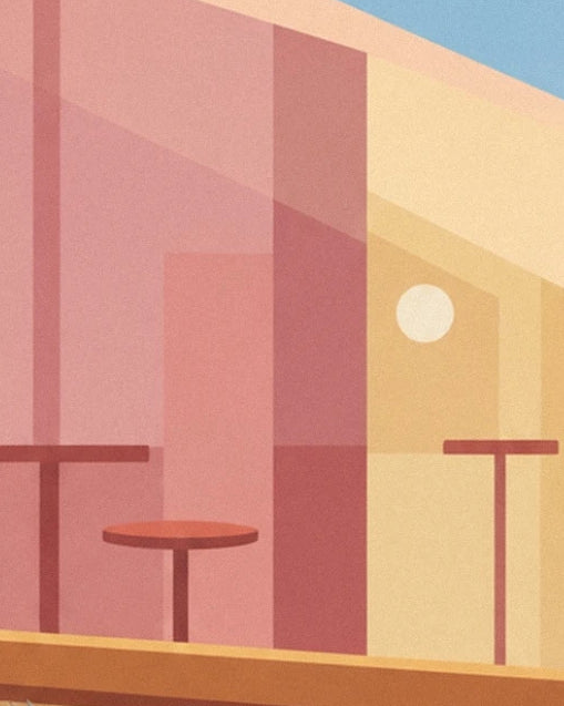 The red tables of the patisserie in front of a façade in shades of pink and yellow