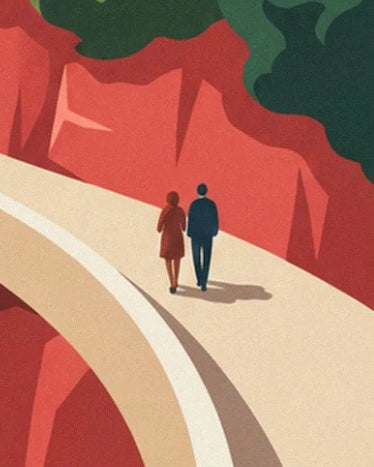 Un couple sur la route crème, au pied des roches rouges de l'Estérel