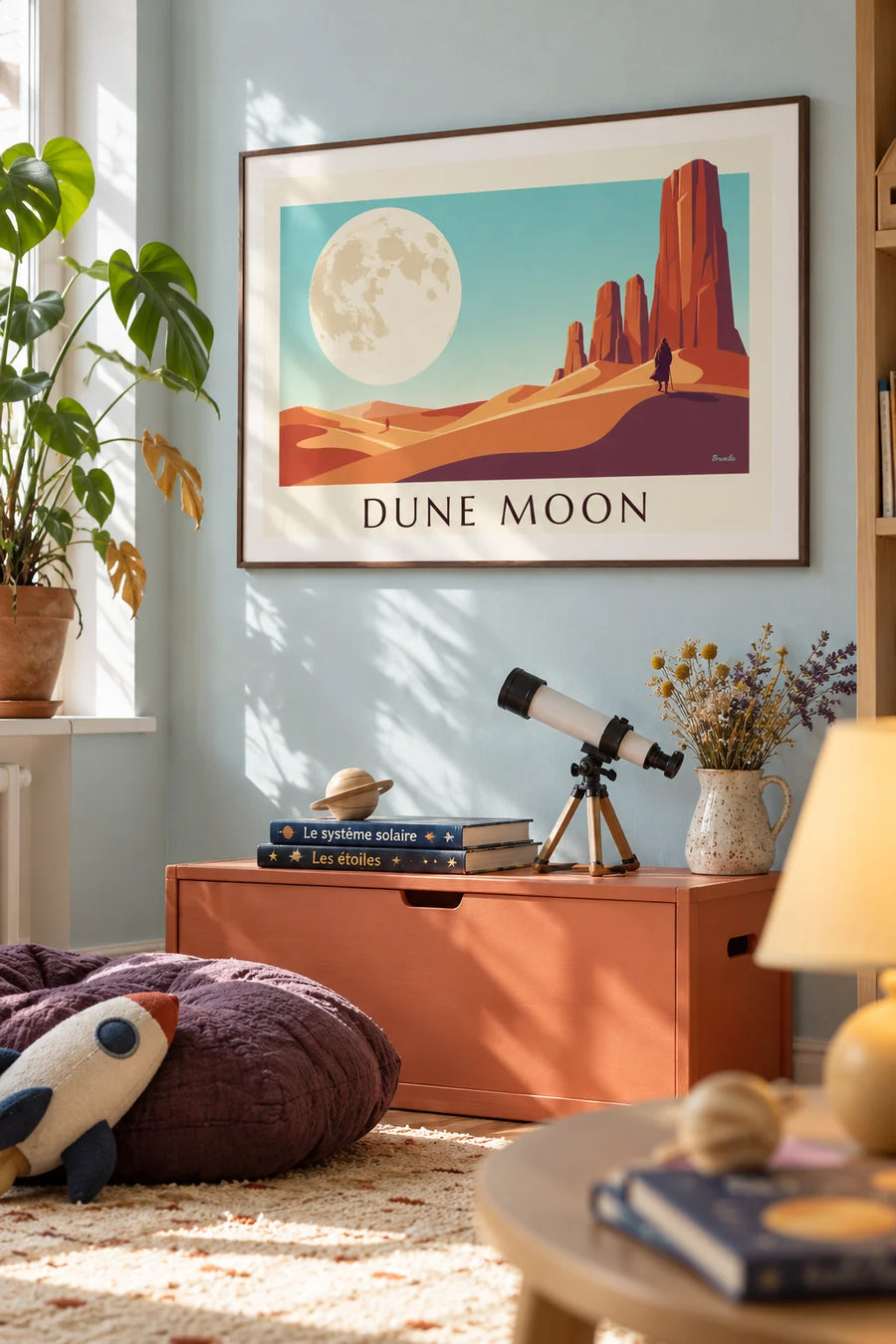 Poster of a science fiction desert under a giant moon: framed on the wall