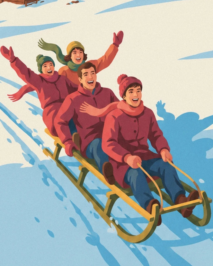 La famille en bonnets et manteaux rouges sur une luge en bois dans la neige