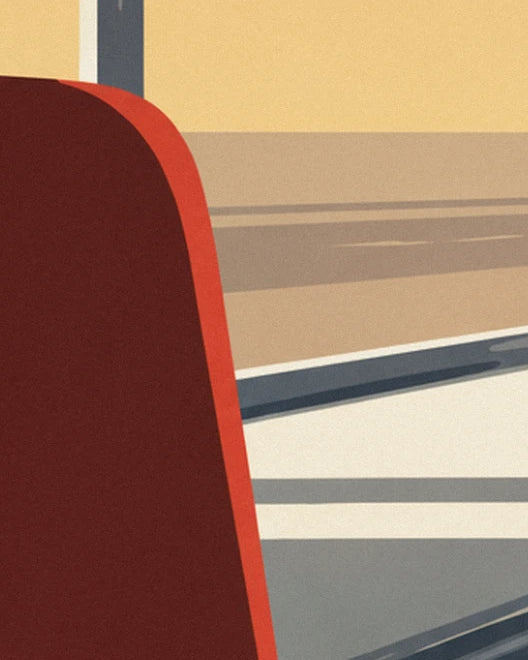 Le dossier rouge sombre d'une banquette du diner, près de la vitre aux reflets beiges