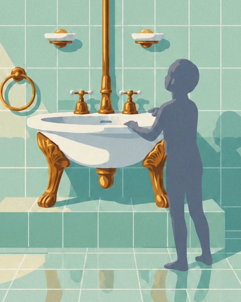 The white washbasin on golden legs and the silhouette against the green tiles