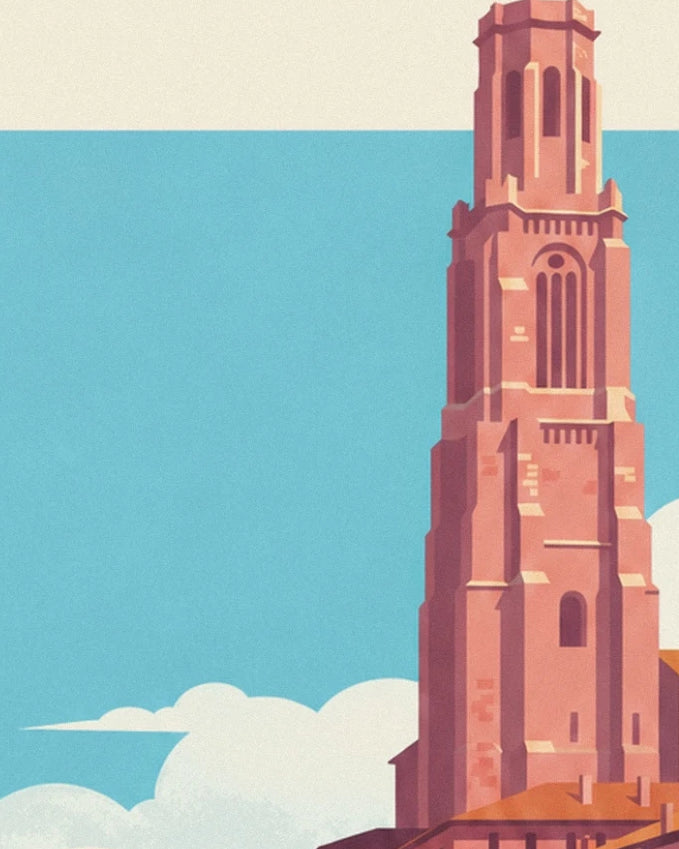 The pink brick tower with tall slender windows against the blue sky of Toulouse