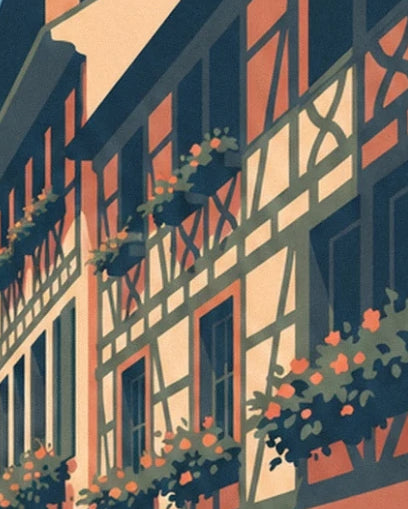 The timber framing on the cream and coral façades, adorned with flower-filled window boxes