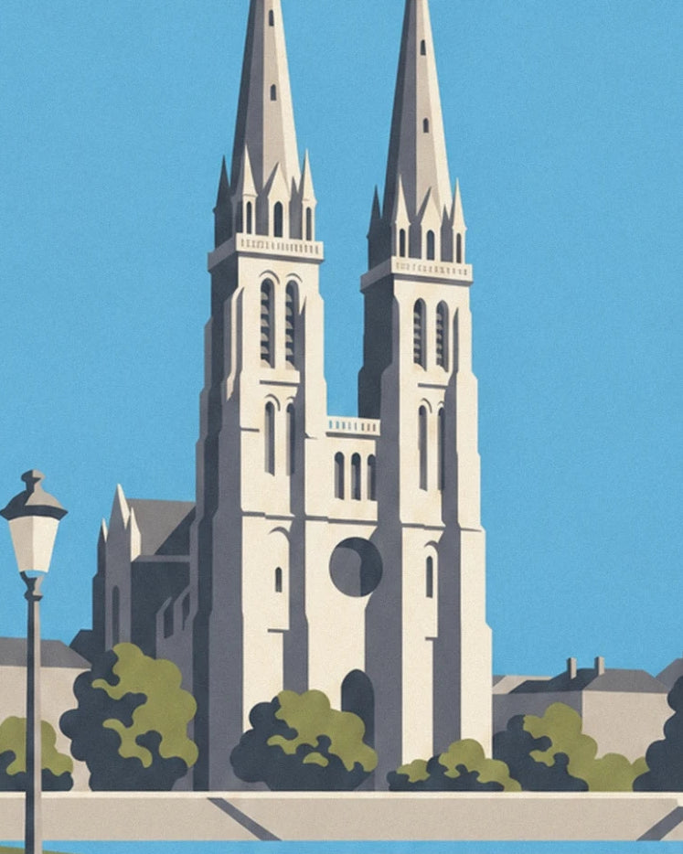 The 2 spires of the cathedral of Tours above the trees and rooftops