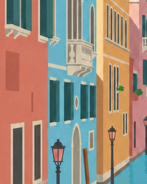 Les façades rouge, bleue et ocre avec leur balcon blanc et 2 lampadaires