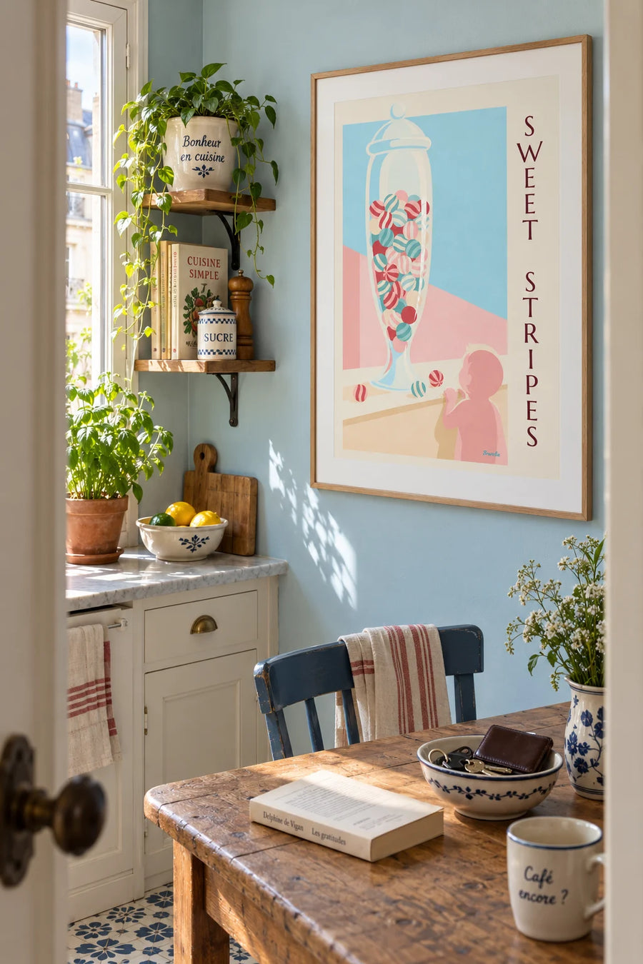 Poster of a glass jar of striped candies on a counter: framed on the wall