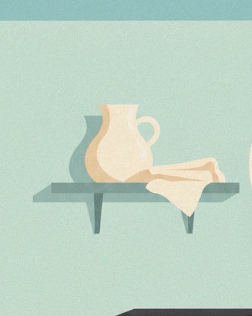 The cream jug and tea towel on a small blue-green shelf