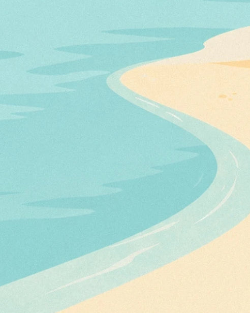 The turquoise sea edged with golden sand, with fine lines of foam along the shore