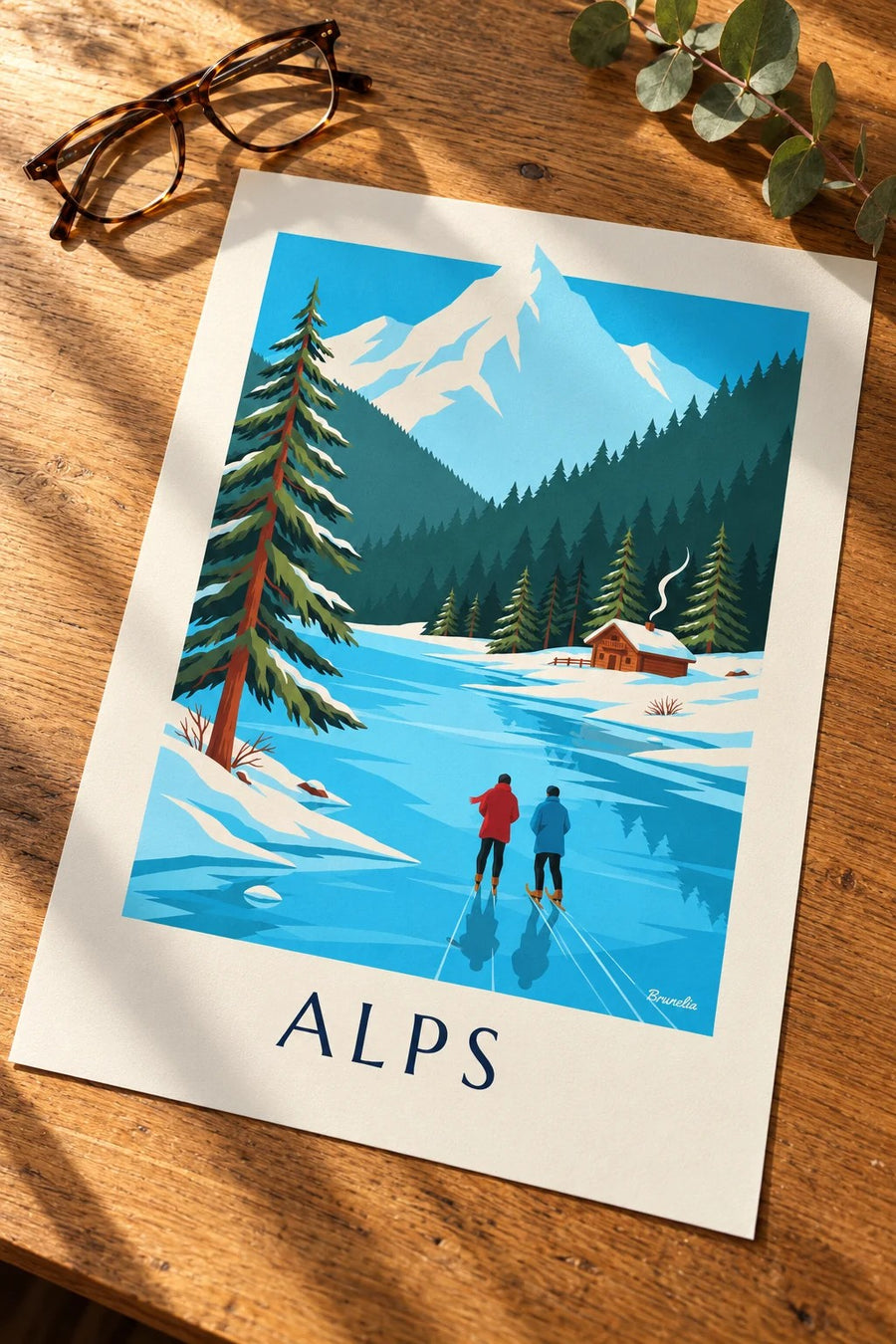 Poster Schlittschuhläufer auf einem zugefrorenen See vor verschneiten Alpen: flach auf einem Tisch
