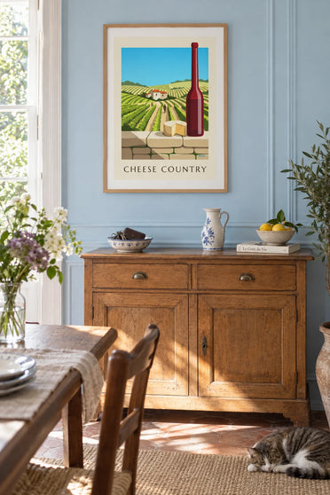 Poster of farmhouse cheese and red wine in front of the vineyards: framed on a wall