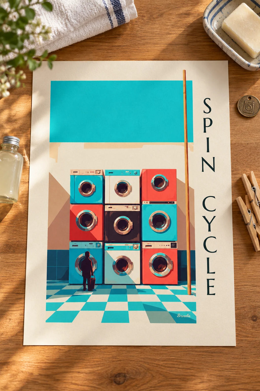 Poster con griglia di 9 lavatrici colorate : appoggiato su un tavolo